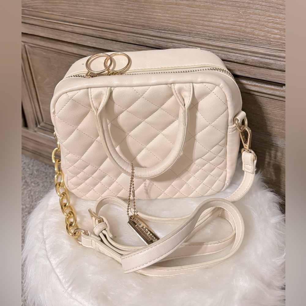 Beige bag. With golden. Classy. fancy. leather. With chain